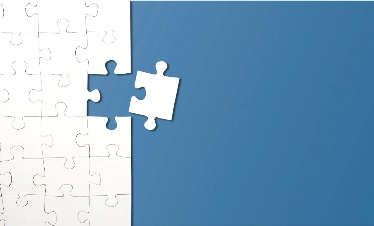 Jigsaw puzzle with the last piece being put in place